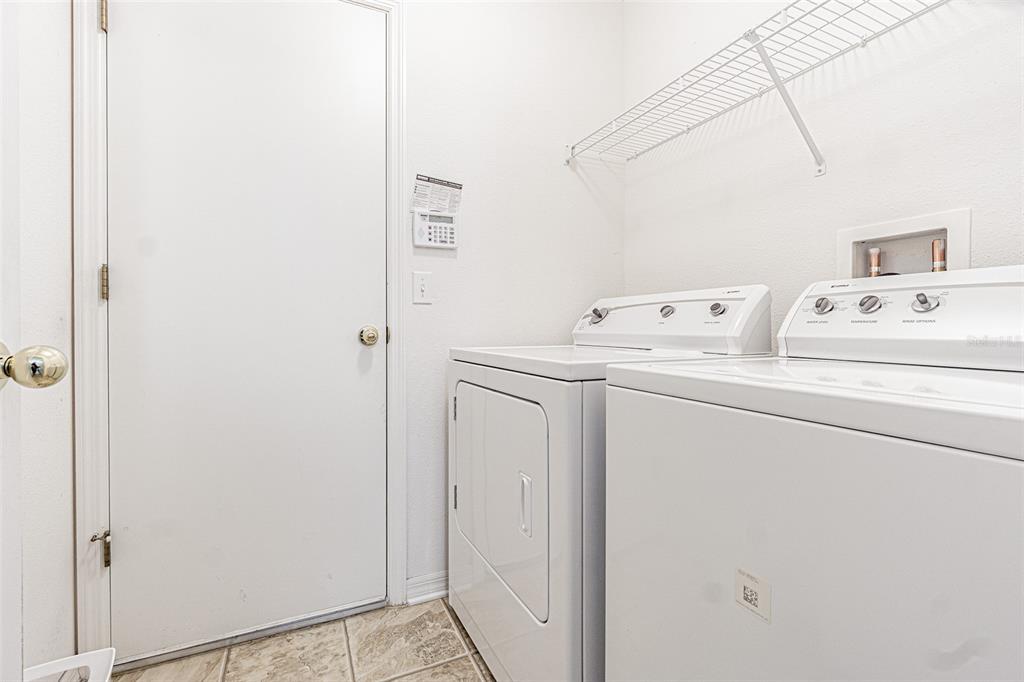 6283 Lorraine Lane Spring Hill, FL 34608 - Photo 22 of 27 a utility room with dryer and washer