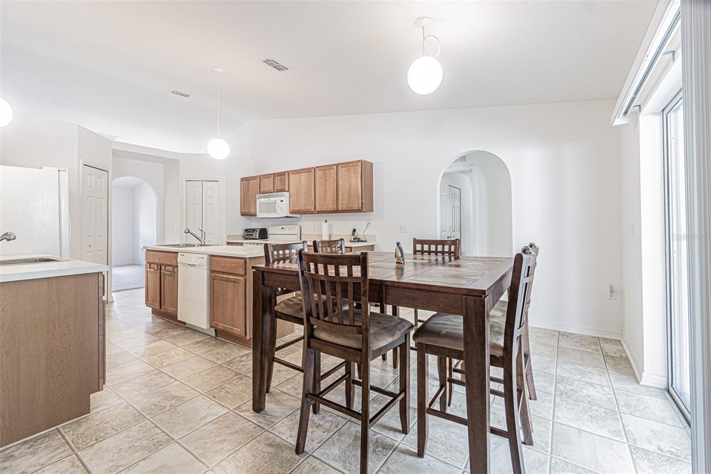 6283 Lorraine Lane Spring Hill, FL 34608 - Photo 9 of 27 a view of a dining room with furniture and a window