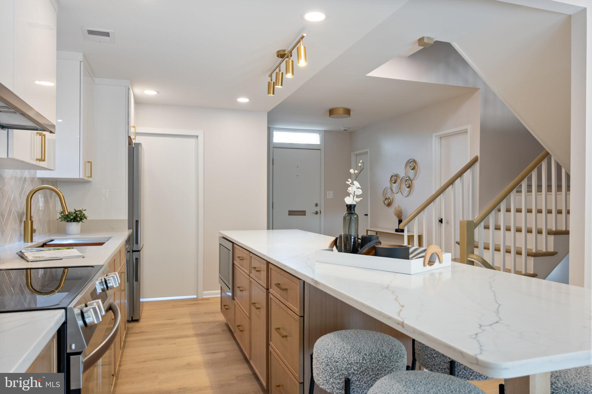 1309 4th Street Southwest, Unit TH9 Washington, DC 20024 - Photo 11 of 63 a kitchen with sink cabinets and window
