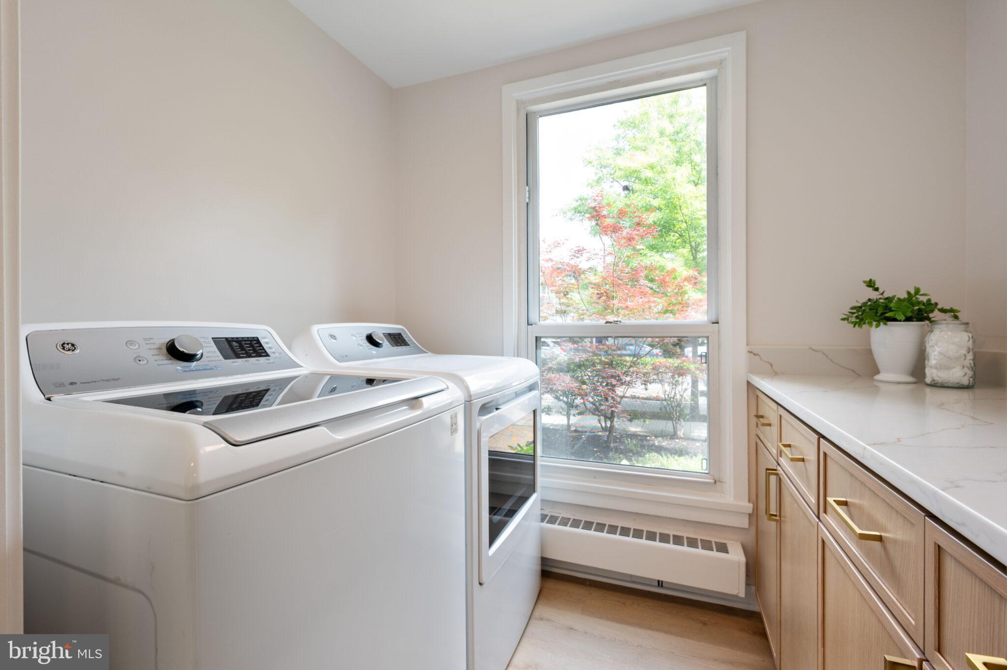 1309 4th Street Southwest, Unit TH9 Washington, DC 20024 - Photo 20 of 63 a utility room with dryer and washer