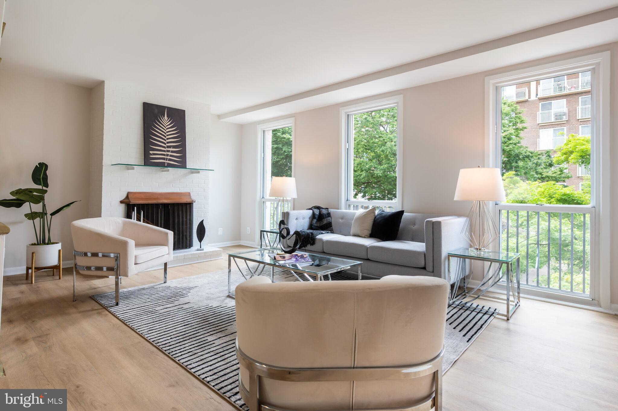 1309 4th Street Southwest, Unit TH9 Washington, DC 20024 - Photo 24 of 63 a living room with furniture and a fireplace