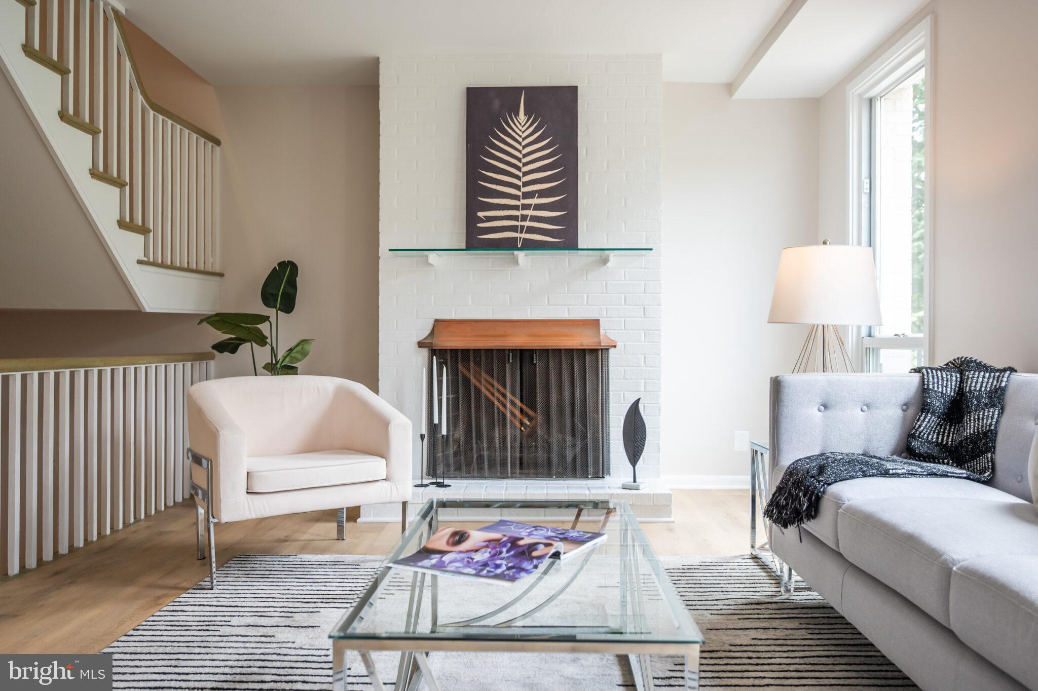 1309 4th Street Southwest, Unit TH9 Washington, DC 20024 - Photo 25 of 63 a living room with furniture and a fireplace