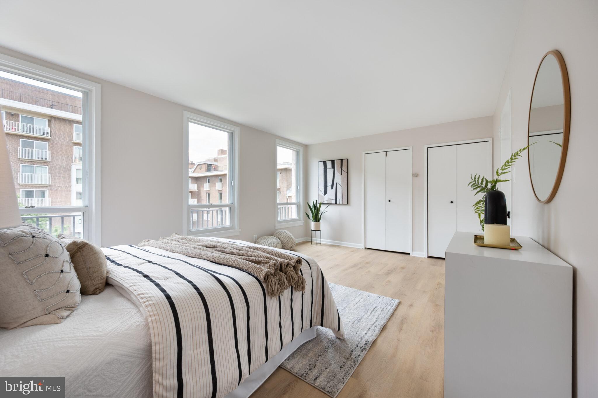 1309 4th Street Southwest, Unit TH9 Washington, DC 20024 - Photo 38 of 63 a bed room with a bed and a window