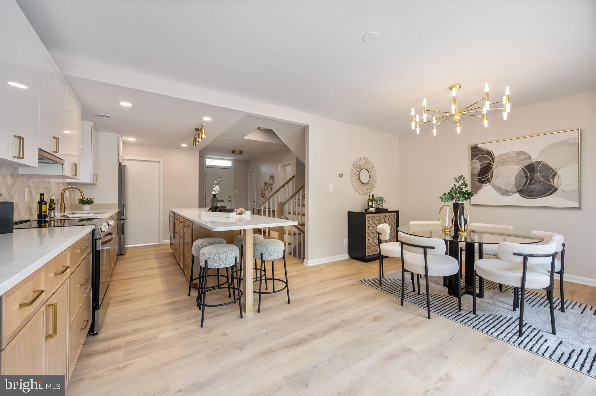 1309 4th Street Southwest, Unit TH9 Washington, DC 20024 - Photo 4 of 63 a view of a dining room with furniture and wooden floor