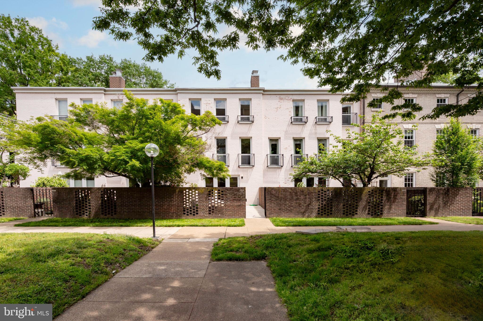 1309 4th Street Southwest, Unit TH9 Washington, DC 20024 - Photo 45 of 63 a front view of a house with garden