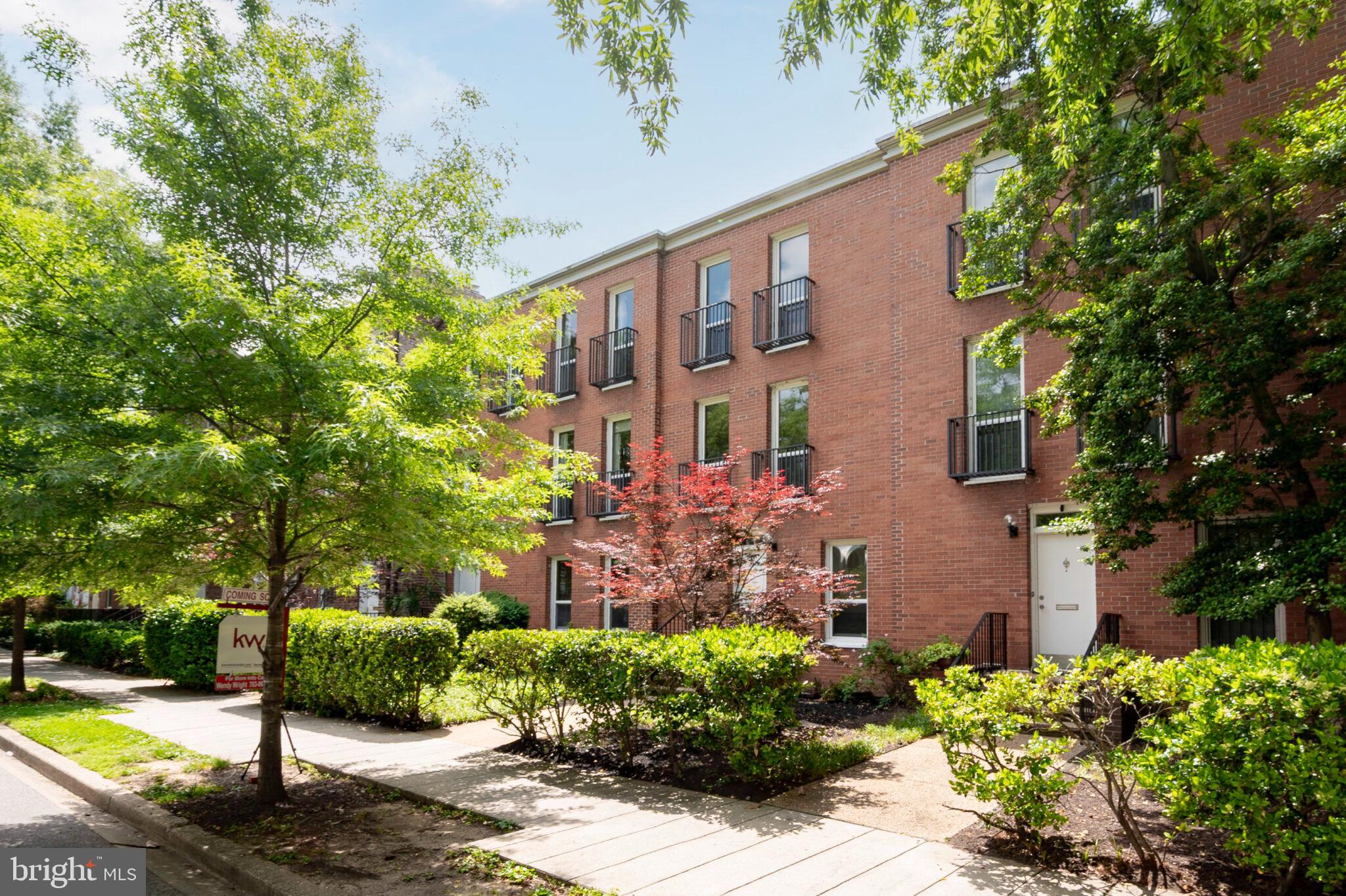 1309 4th Street Southwest, Unit TH9 Washington, DC 20024 - Photo 48 of 63 a front view of a house with garden