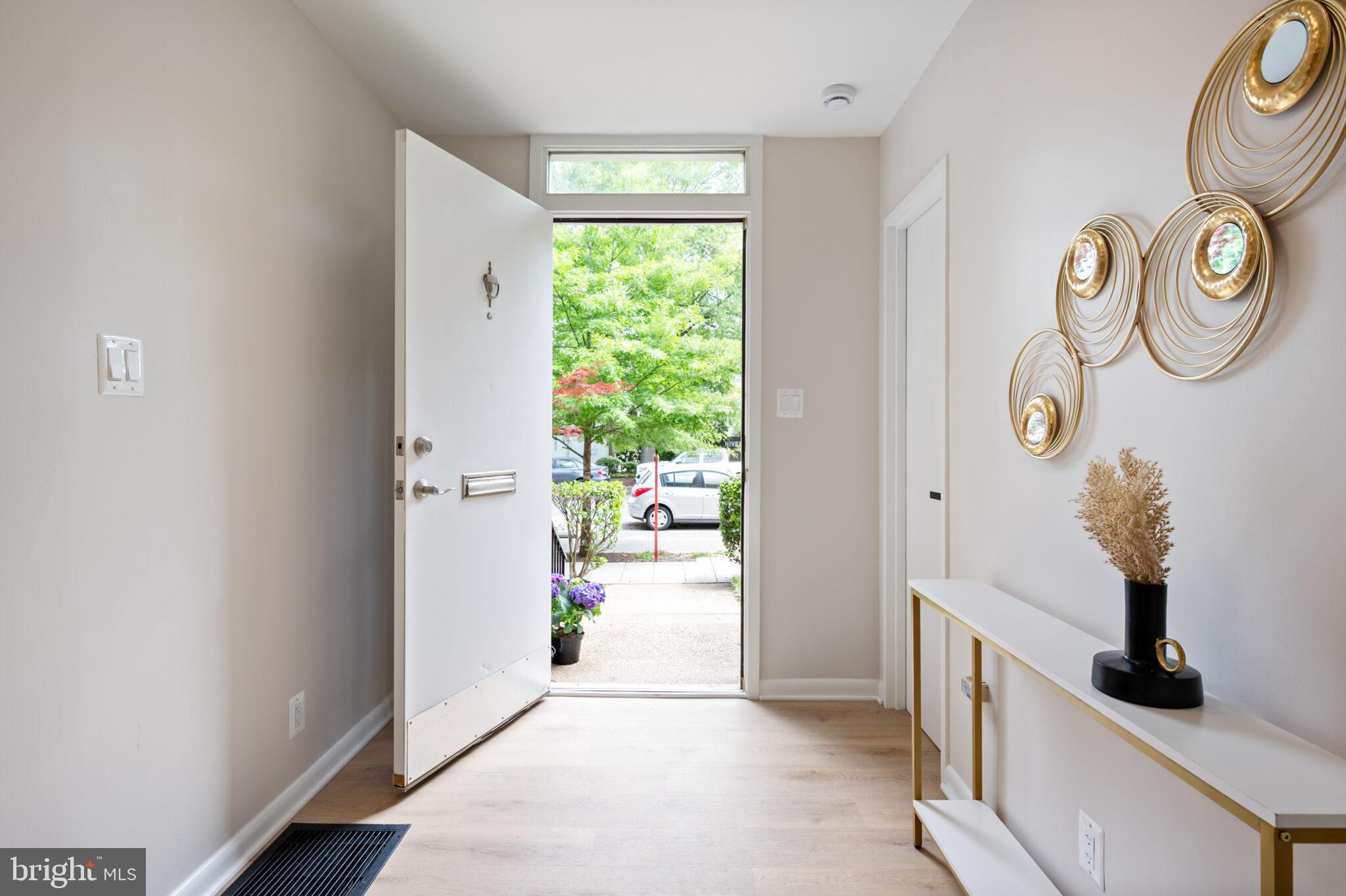 1309 4th Street Southwest, Unit TH9 Washington, DC 20024 - Photo 6 of 63 a hall way with furniture and a window