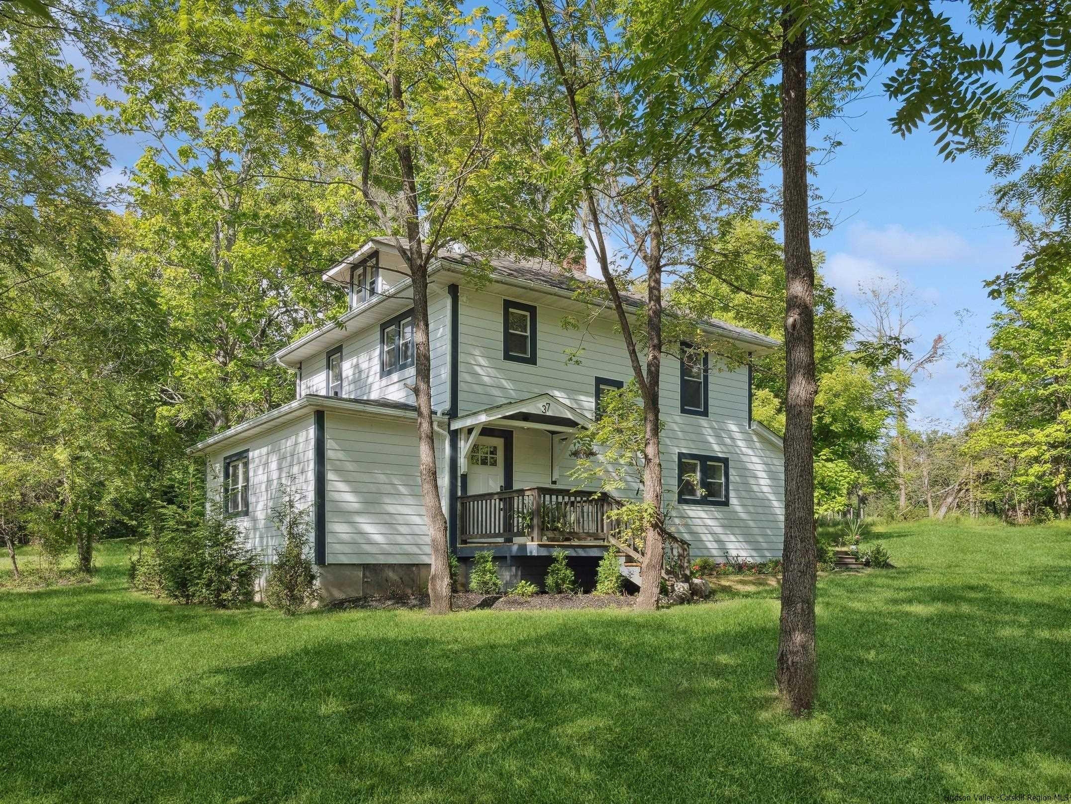 37 Towpath Road Accord, NY 12404 - Photo 1 of 29 a front view of a house with a garden