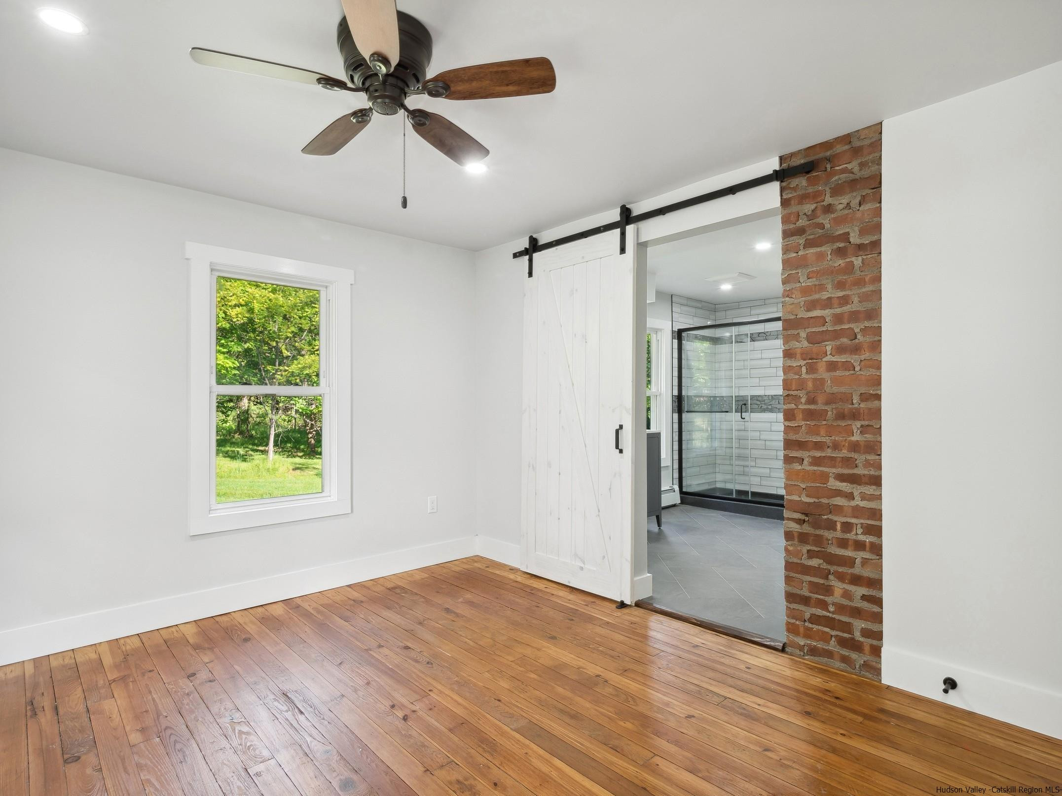 37 Towpath Road Accord, NY 12404 - Photo 14 of 29 wooden floor in an empty room with a window