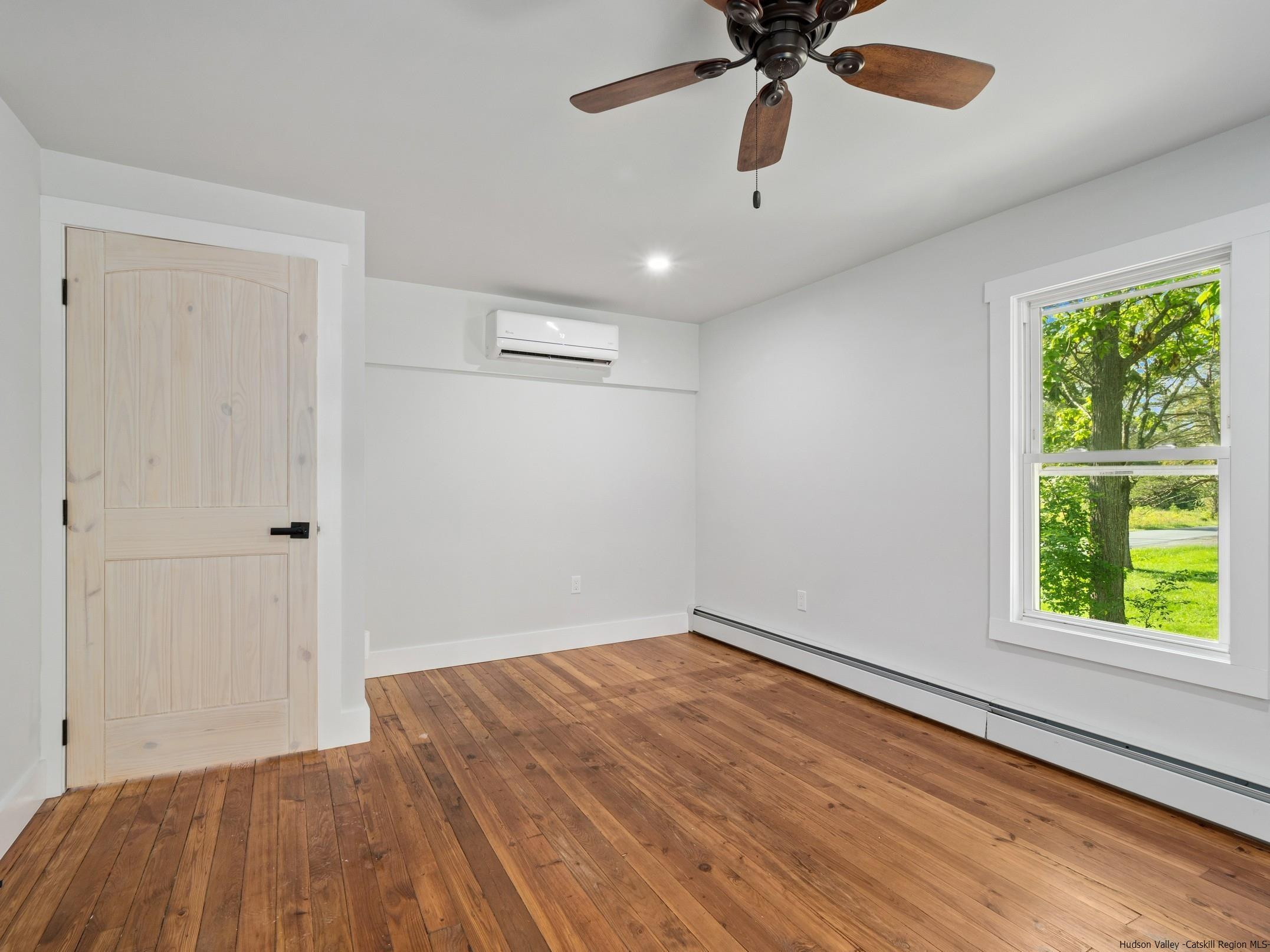 37 Towpath Road Accord, NY 12404 - Photo 15 of 29 wooden floor in an empty room with a window