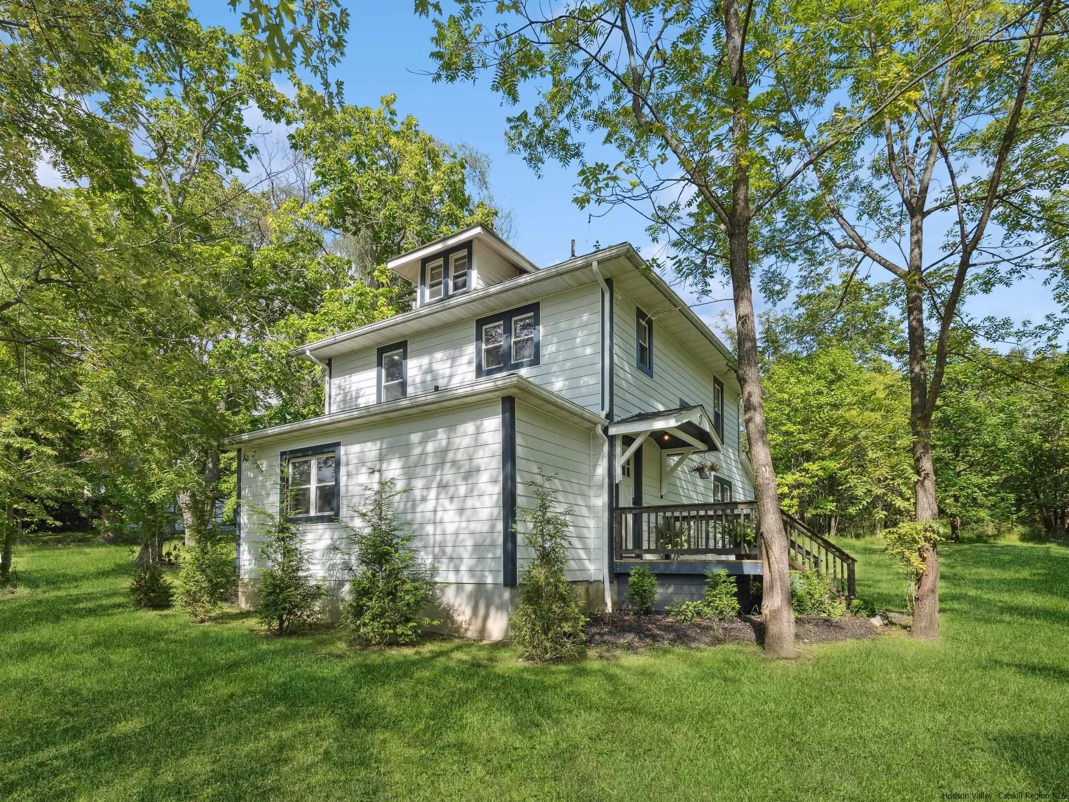 37 Towpath Road Accord, NY 12404 - Photo 2 of 29 a front view of a house with garden