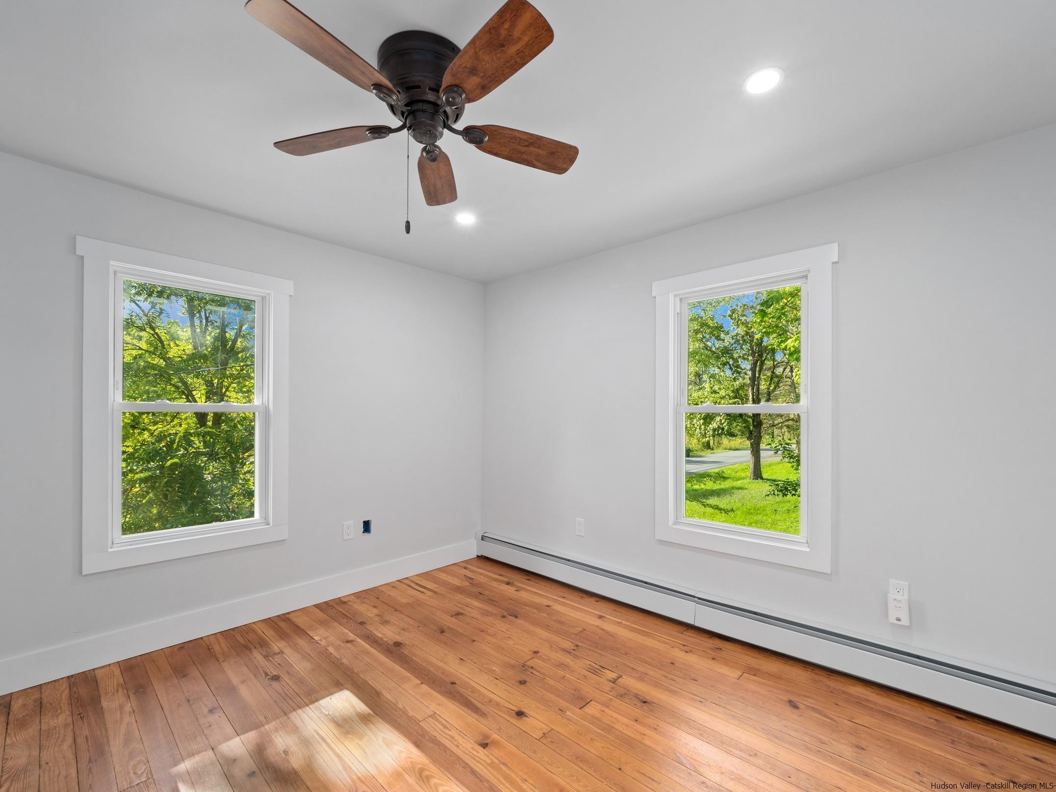 37 Towpath Road Accord, NY 12404 - Photo 21 of 29 an empty room with a window and a ceiling fan