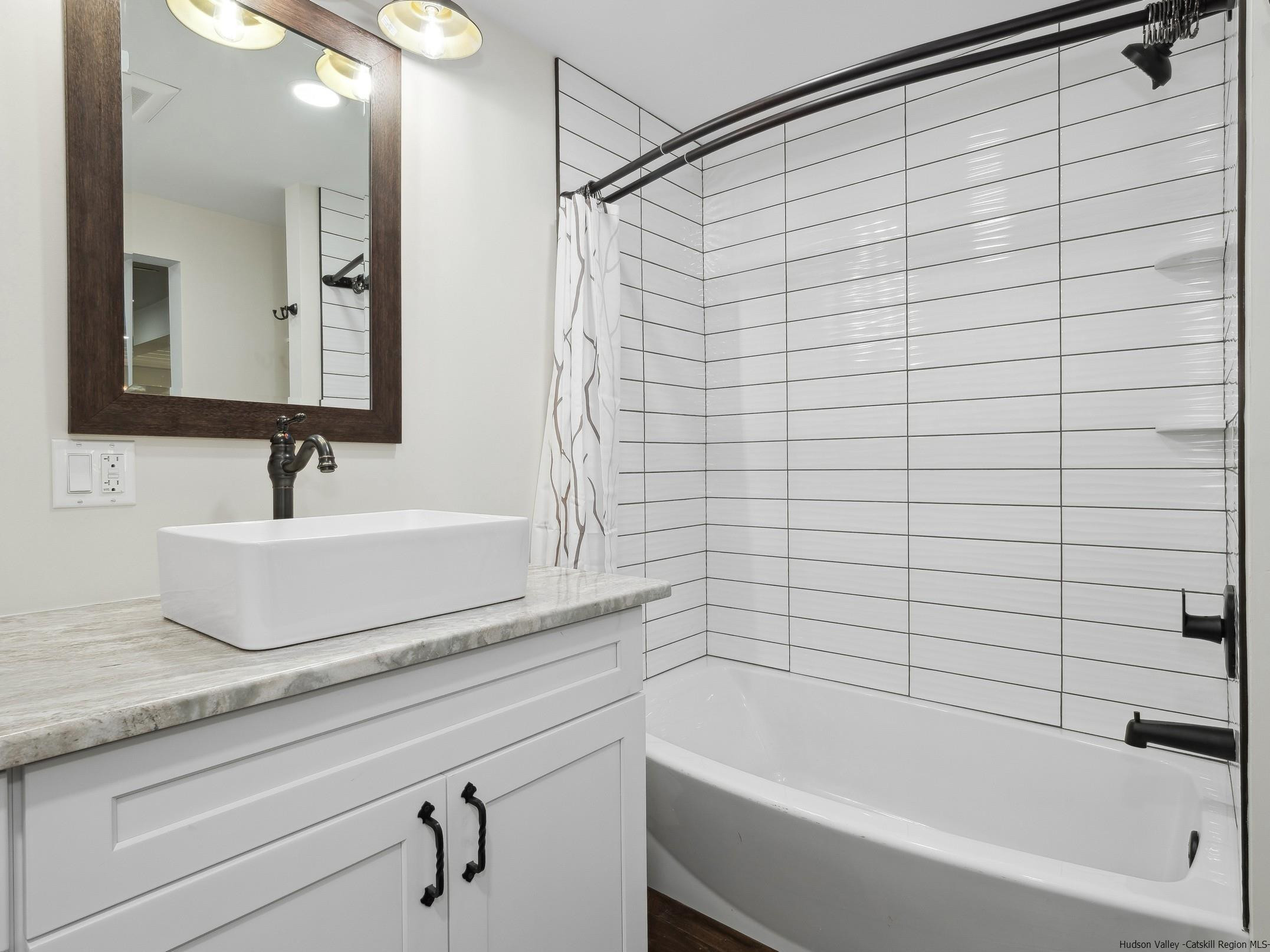 37 Towpath Road Accord, NY 12404 - Photo 6 of 29 a bathroom with a bathtub and a sink