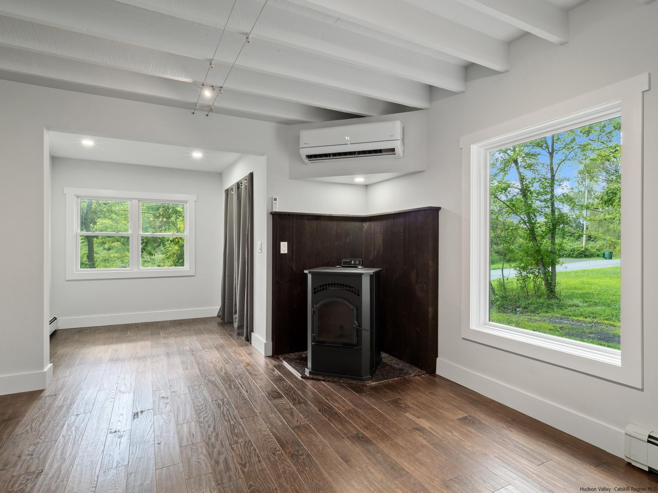 37 Towpath Road Accord, NY 12404 - Photo 9 of 29 an empty room with windows and a fireplace