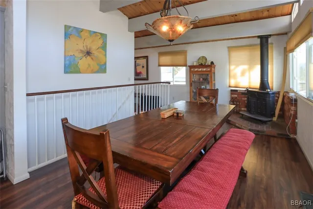 a view of a dining room with furniture wooden floor and chandelier