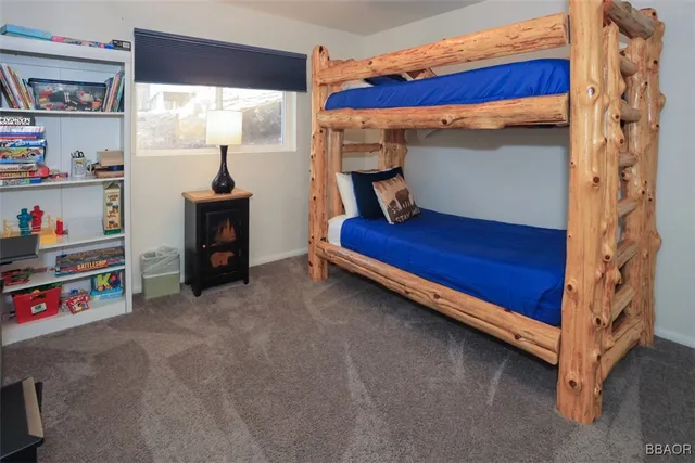 a view of bedroom with furniture and a window