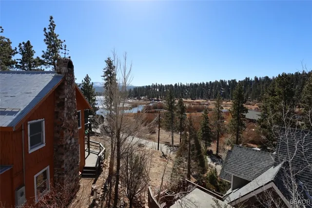 a view of a backyard with sitting area