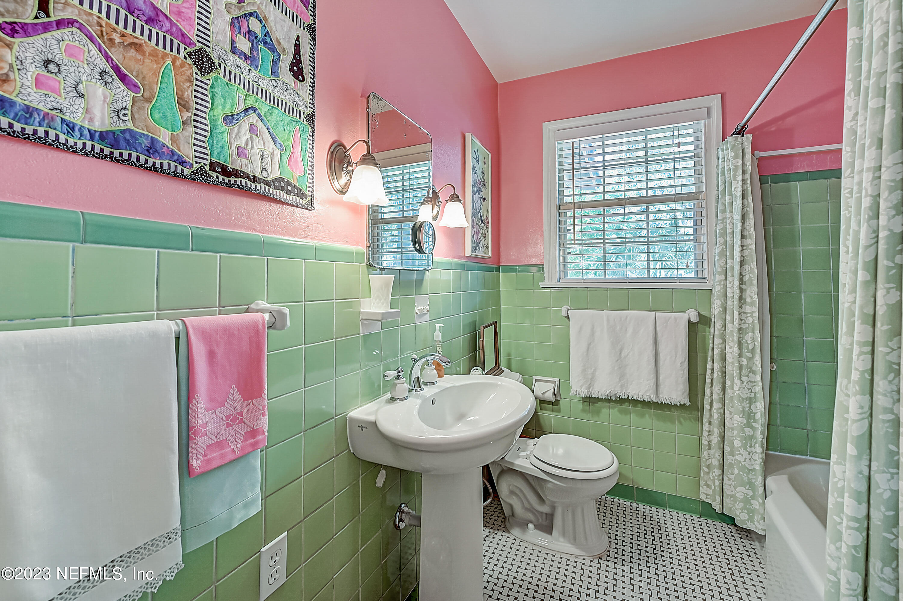 2631 Jolly Road Jacksonville, FL 32207 - Photo 27 of 42 a bathroom with a sink toilet and shower