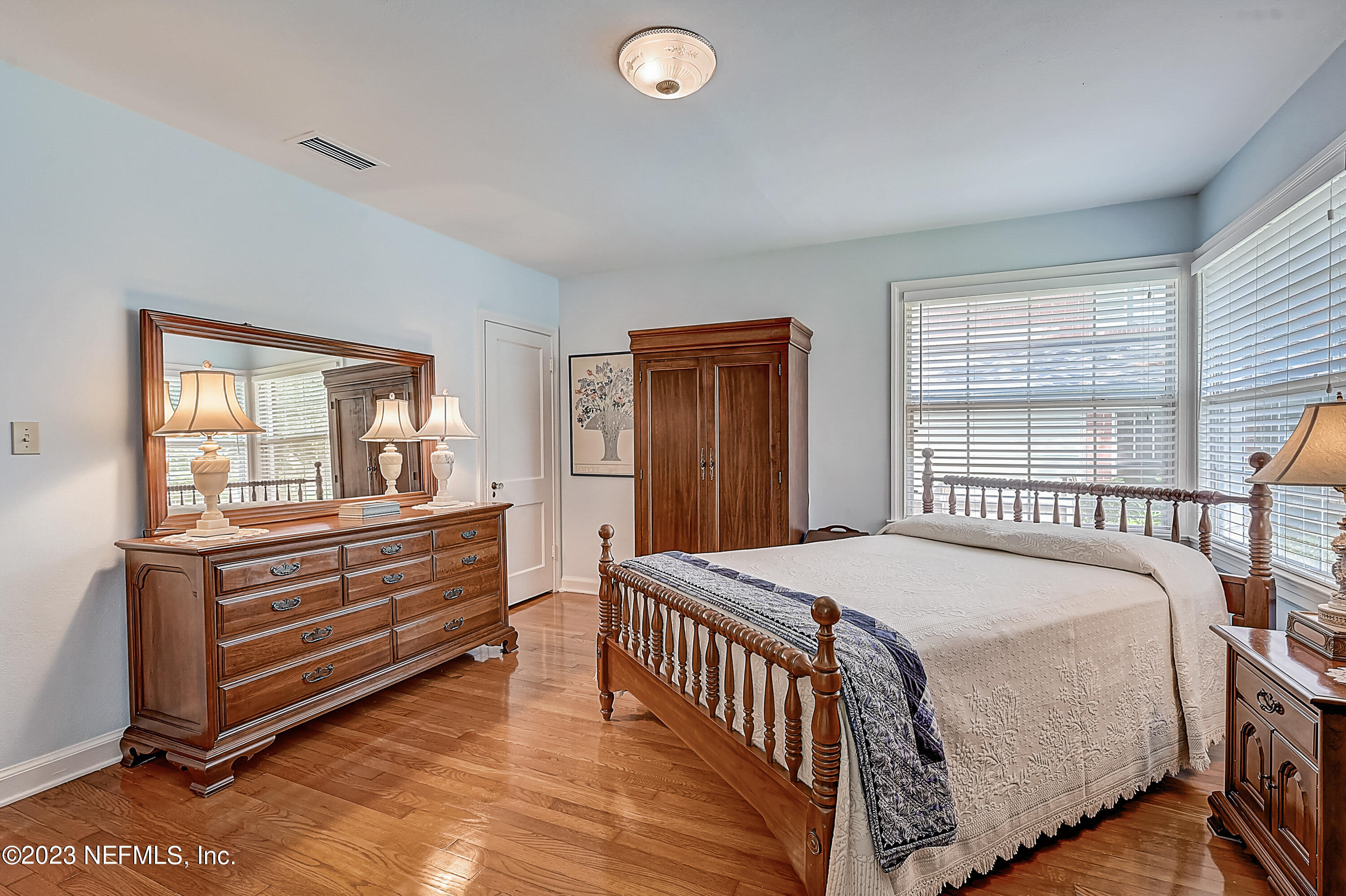 2631 Jolly Road Jacksonville, FL 32207 - Photo 32 of 42 a bedroom with a bed and a large window