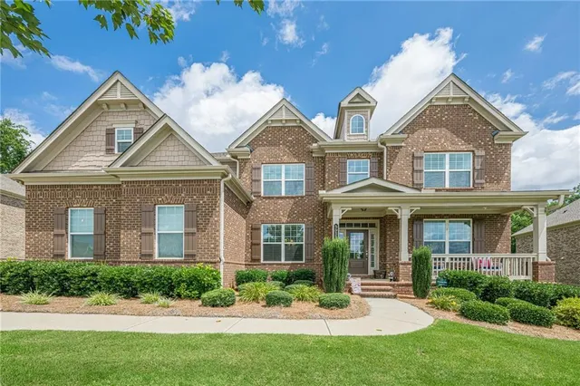 front view of a house with a yard