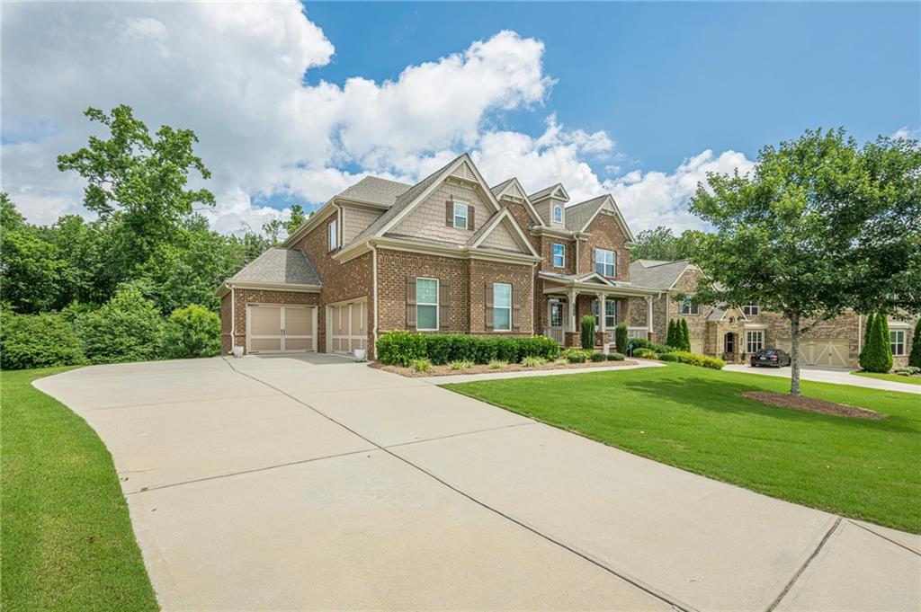 5515 Cheatam Avenue Cumming, GA 30040 - Photo 2 of 99 a front view of a house with a garden