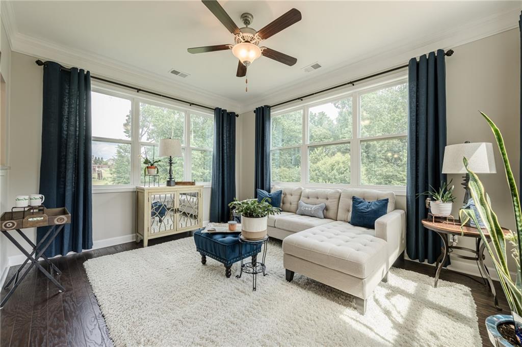 5515 Cheatam Avenue Cumming, GA 30040 - Photo 28 of 99 a living room with furniture and a large window