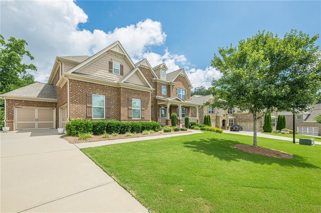 5515 Cheatam Avenue Cumming, GA 30040 - Photo 3 of 99 a front view of a house with a yard