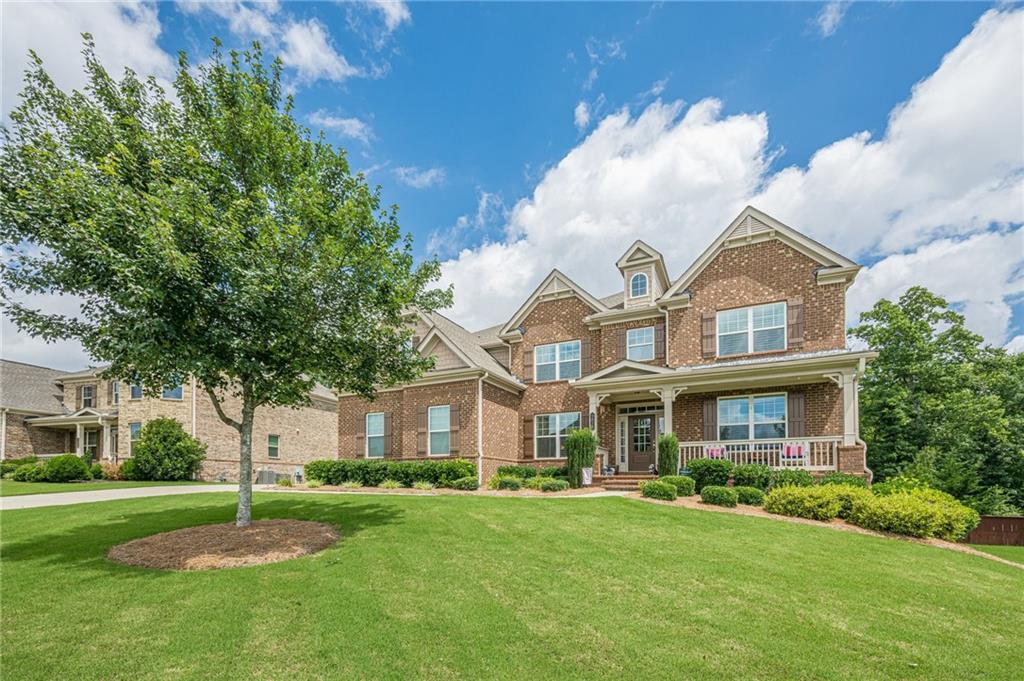 5515 Cheatam Avenue Cumming, GA 30040 - Photo 4 of 99 a front view of a house with a garden