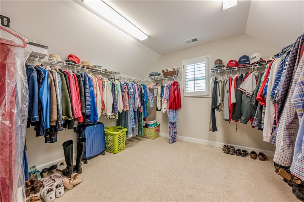 5515 Cheatam Avenue Cumming, GA 30040 - Photo 49 of 99 a view of walk in closet with clothes