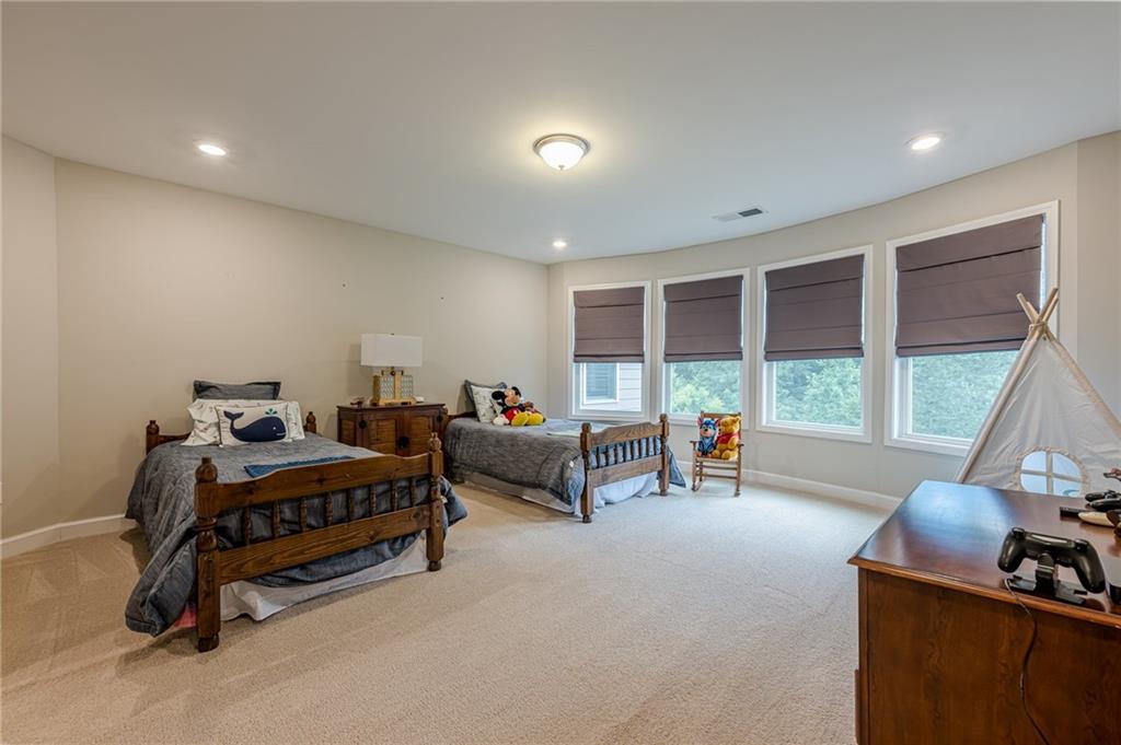 5515 Cheatam Avenue Cumming, GA 30040 - Photo 51 of 99 a bedroom with furniture and a large window