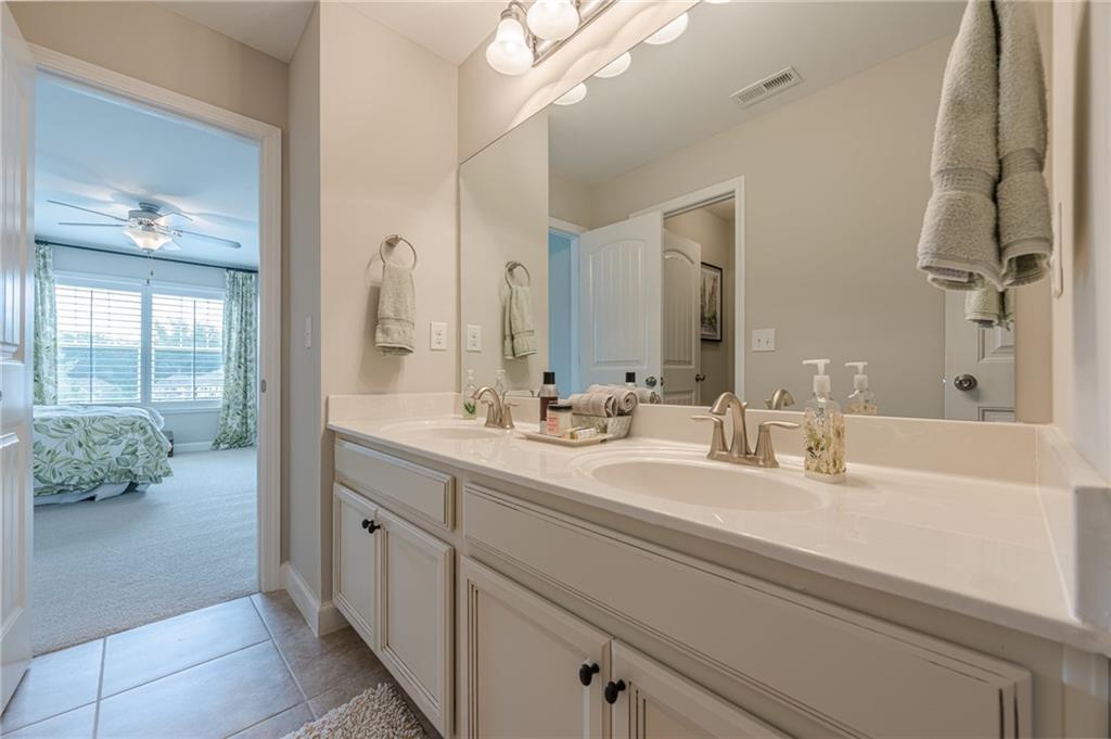 5515 Cheatam Avenue Cumming, GA 30040 - Photo 56 of 99 a bathroom with a double vanity sink mirror and