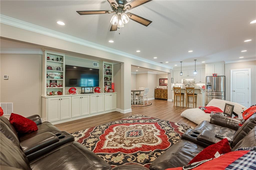 5515 Cheatam Avenue Cumming, GA 30040 - Photo 69 of 99 a living room with furniture and a flat screen tv