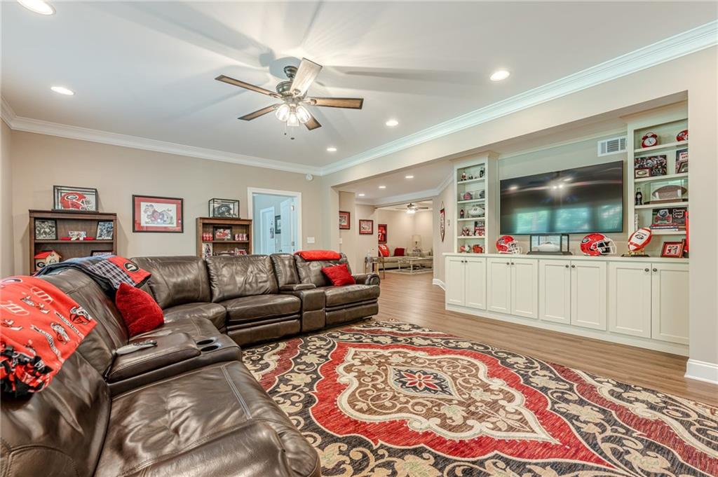 5515 Cheatam Avenue Cumming, GA 30040 - Photo 71 of 99 a living room with furniture and a flat screen tv