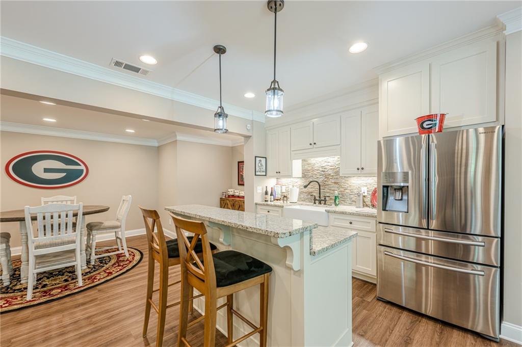 5515 Cheatam Avenue Cumming, GA 30040 - Photo 76 of 99 a kitchen with stainless steel appliances a refrigerator a stove a sink and a refrigerator