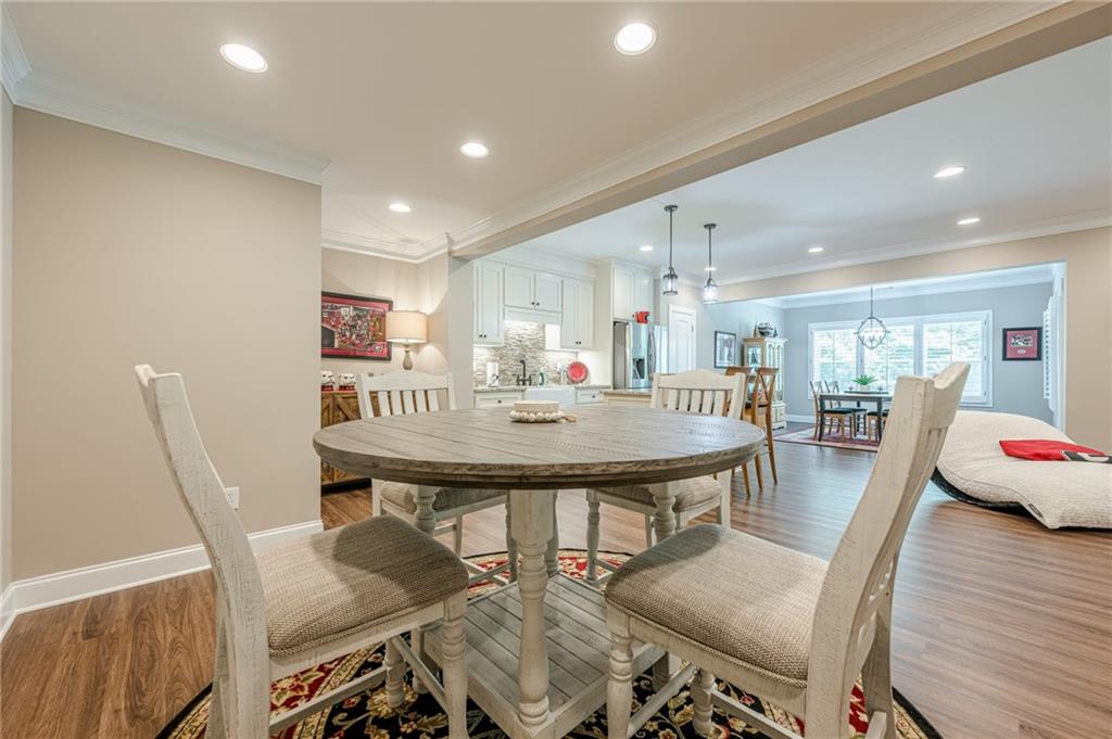 5515 Cheatam Avenue Cumming, GA 30040 - Photo 80 of 99 a view of a dining room with furniture and wooden floor