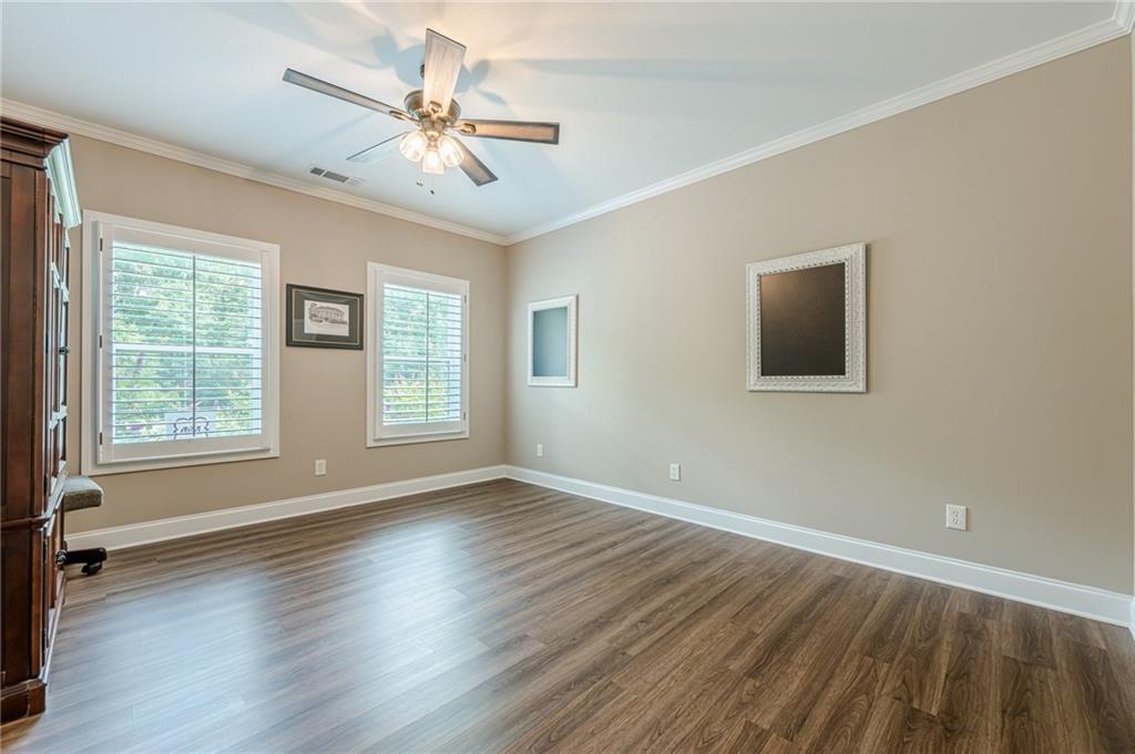 5515 Cheatam Avenue Cumming, GA 30040 - Photo 81 of 99 a view of an empty room with wooden floor and a window