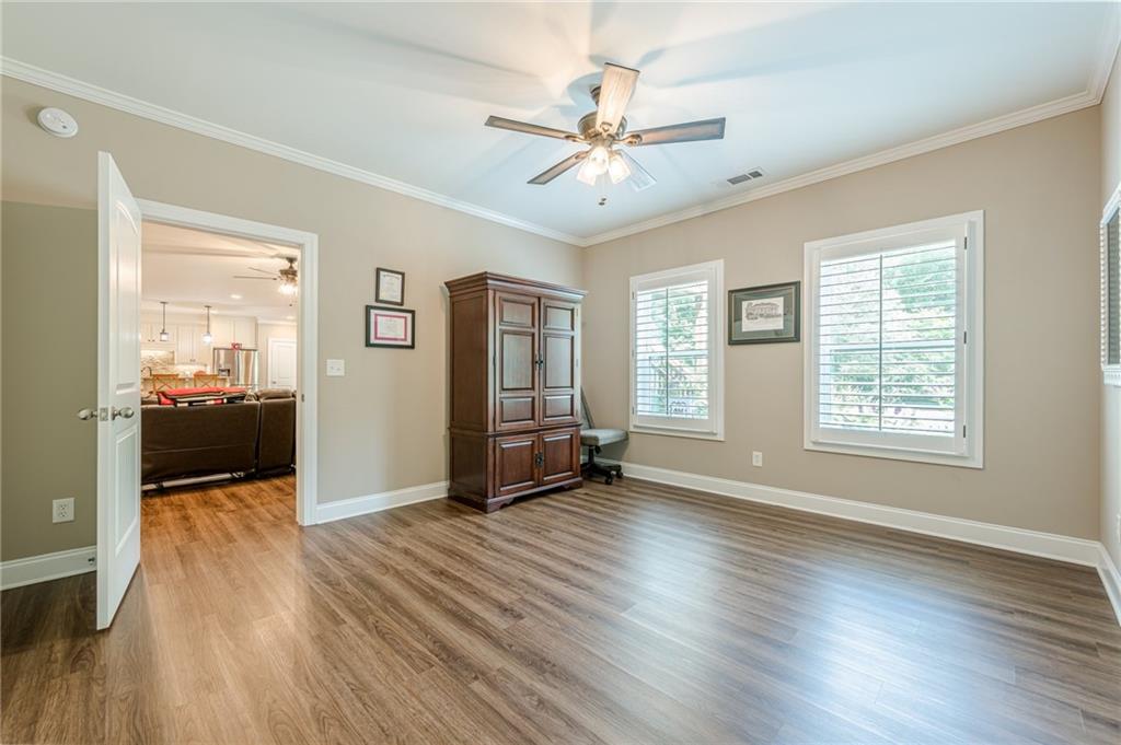 5515 Cheatam Avenue Cumming, GA 30040 - Photo 82 of 99 a view of a livingroom with a hardwood floor and a ceiling fan