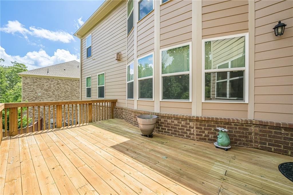 5515 Cheatam Avenue Cumming, GA 30040 - Photo 85 of 99 a view of a roof deck with wooden floor and fence