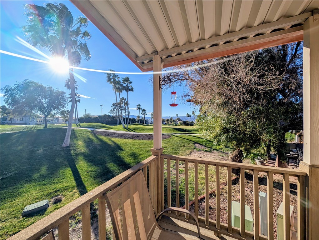 2000 Ramar Road, Unit 89 Bullhead City, AZ 86442 - Photo 7 of 26 Balcony with a sunroom