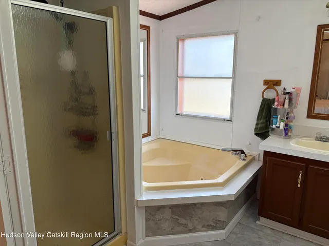 a bathroom with a tub and a sink