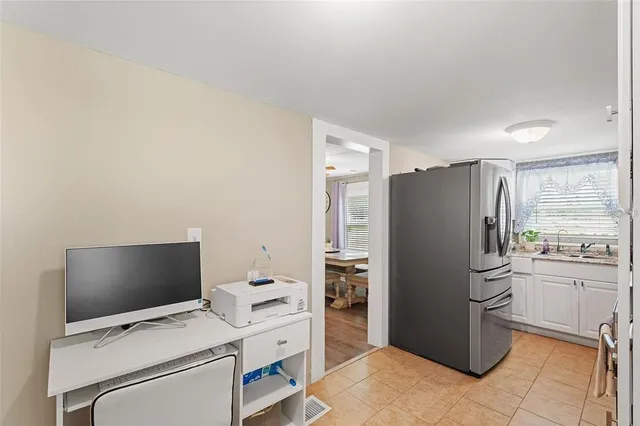 a kitchen with stainless steel appliances a refrigerator stove and sink