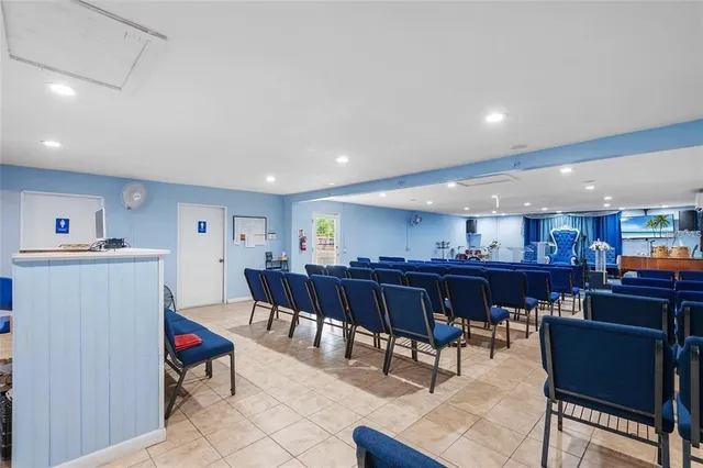 a living room with lots of furniture and kitchen