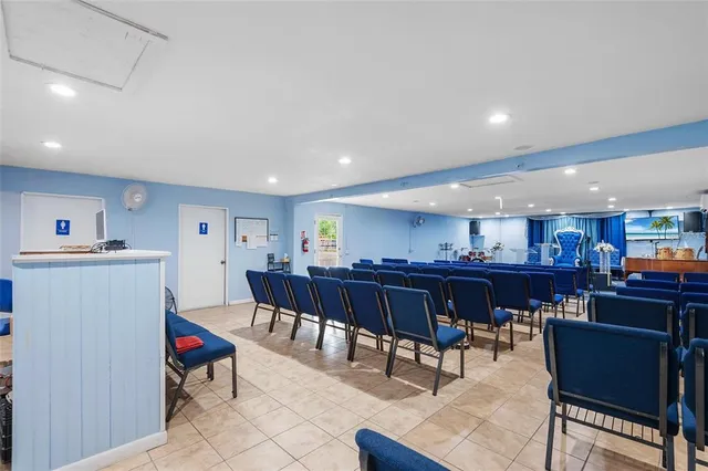 a living room with lots of furniture and kitchen