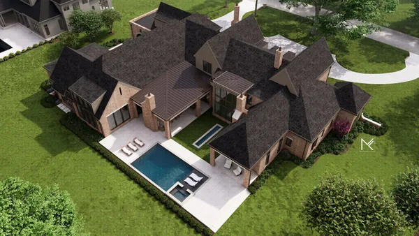 an aerial view of a house with a yard