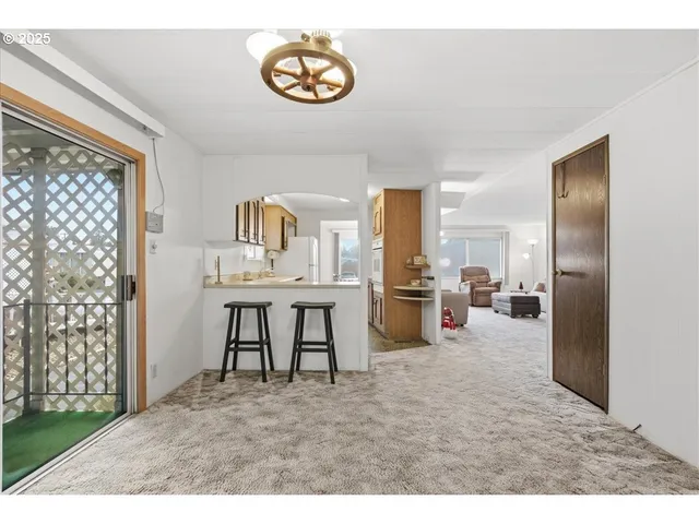 a view of kitchen with furniture and breakfast area