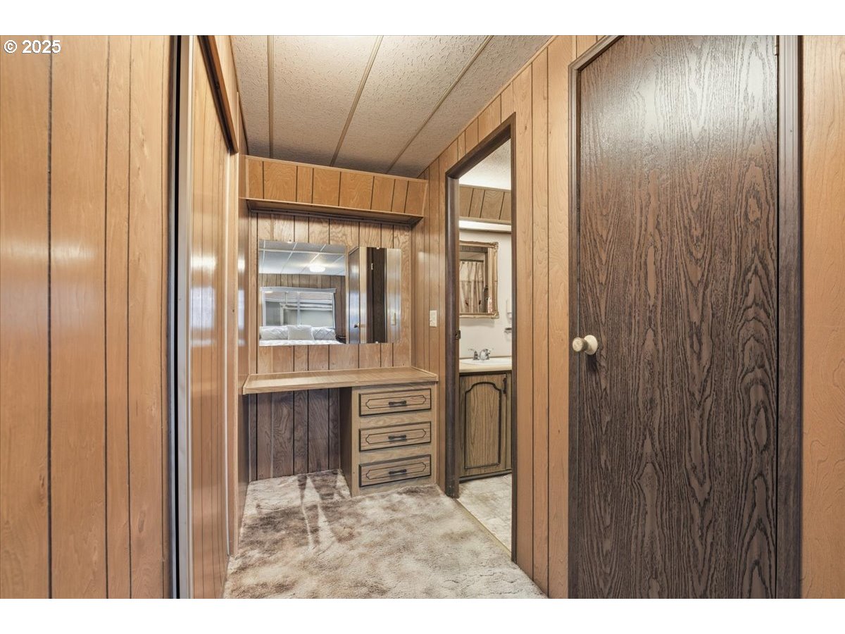 4940 Sunnyside Road Southeast, Unit H5 Salem, OR 97302 - Photo 20 of 35 a view of a hallway with a wooden door
