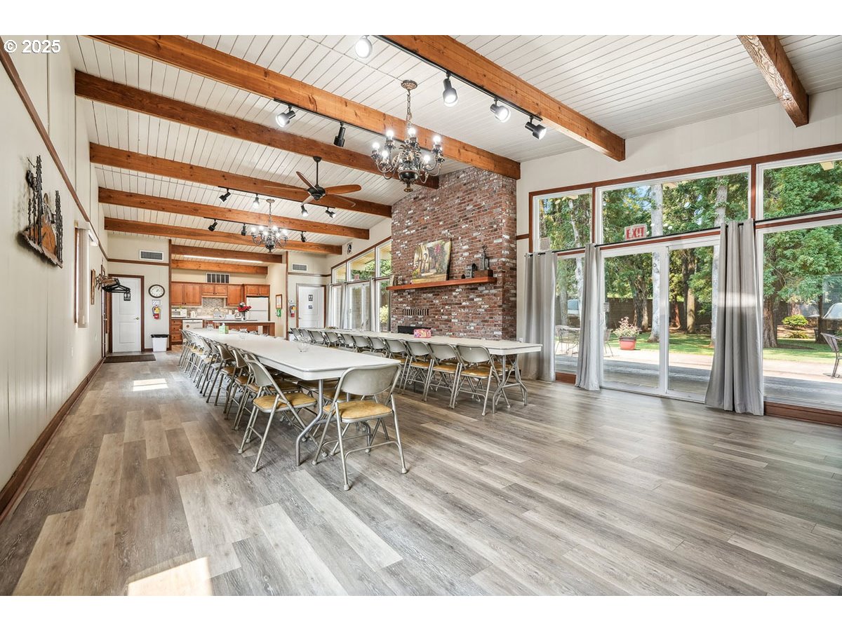 4940 Sunnyside Road Southeast, Unit H5 Salem, OR 97302 - Photo 34 of 35 a dining room with furniture and wooden floor