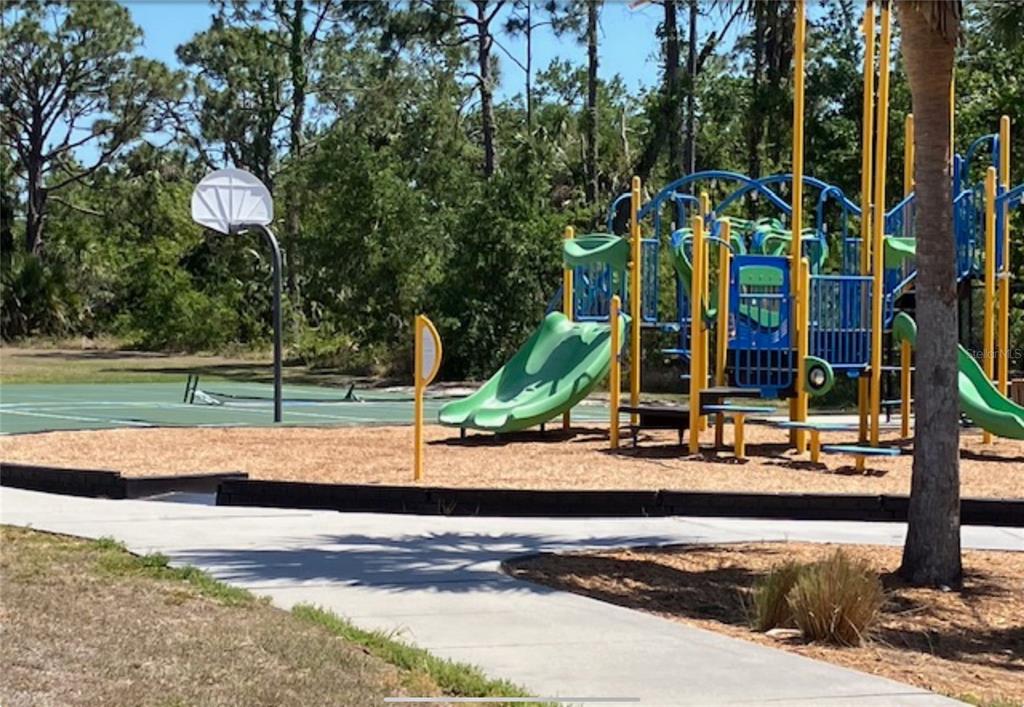 13232 Kitchener Avenue Port Charlotte, FL 33981 - Photo 3 of 5 a view of a park with large trees