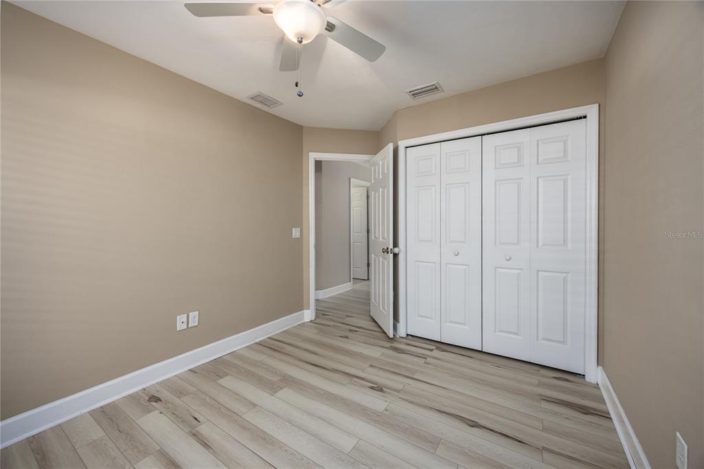 470 Southwest 251st Street Newberry, FL 32669 - Photo 22 of 33 a view of an empty room with wooden floor