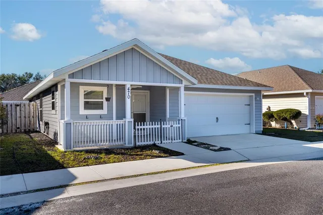 a front view of a house with a garage